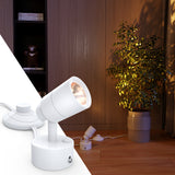 The cylindrical design and white finish of the floor spotlight elegantly enhances your home's ambiance.
