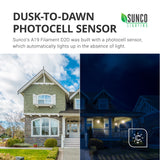 Dusk to Dawn Photocell Sensor. Sunco’s A19 Filament D2D features a built in photocell sensor, which automatically lights up in the absence of light. Image shows house exterior with daylight on one side and no pendant porch lights on, while other side shows same house at night with pendant porch lights on. Dusk to Dawn sensors turn on automatically when no light is detected and off when light is detected for an automatic night light.